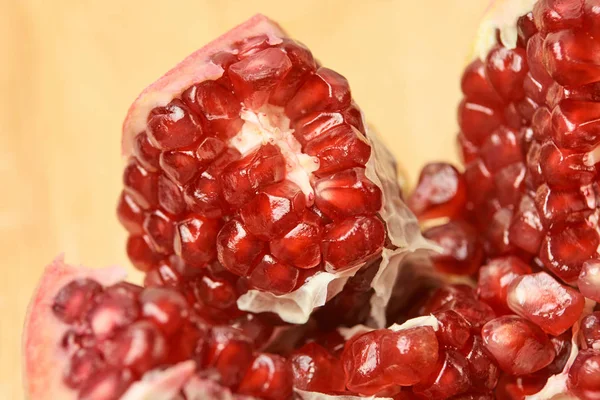 Small red grains. Chopped fruit. Pomegranate slices