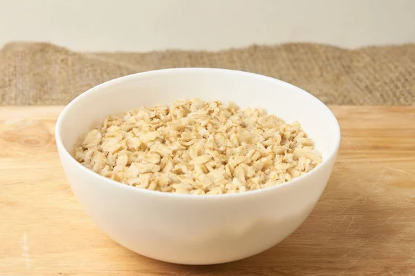 Raw Oatmeal Useful Porridge Neutral Light Background — Stock Photo, Image