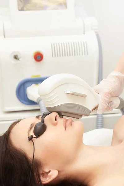 Laser elos medical device. Remove unwanted hair and asteriks. Cosmetology spa procedure at salon. Chin facial depilation