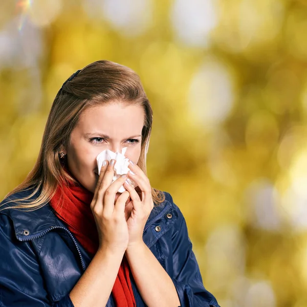 Allergy young woman with couch. Infection sad female hod handkerchief