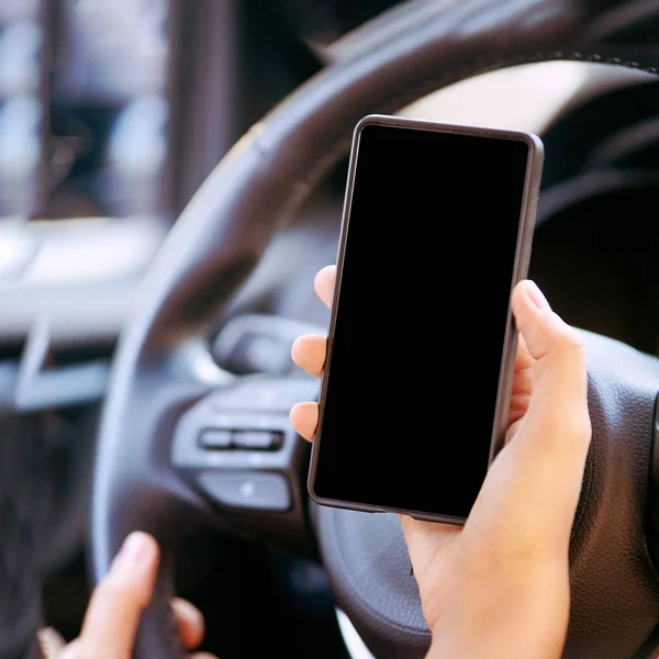 Phone mockup inside car. Travel driver seach maps. Empty screen.