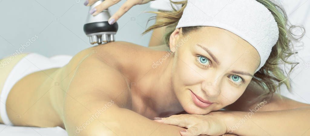 Perfect radio treatment. Woman at spa procedure. Doctor hand and girl body. RF cosmetology lifting. Back body