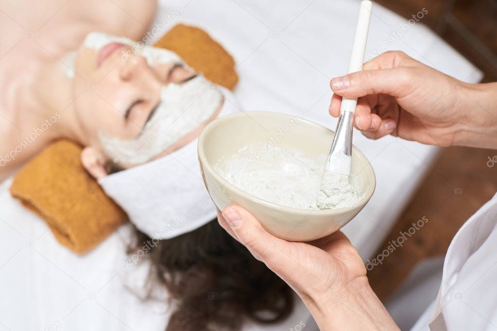 chemic facial peel mask. Cosmetology acne treatment. Young girl at medical spa salon. Brush. Face fruit acid. Sensitive peeling