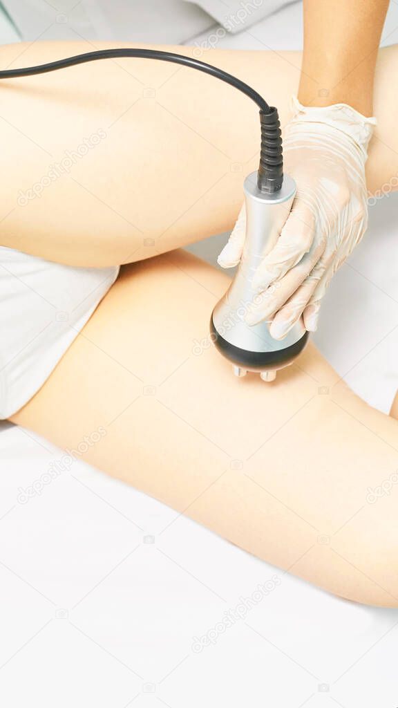Perfect body radio treatment. Woman at spa procedure. Doctor hand and girl body