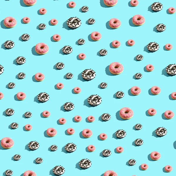 Donut nahtlose Muster. Blauer Hintergrund. Pink- und Schokoladenbonbons — Stockfoto