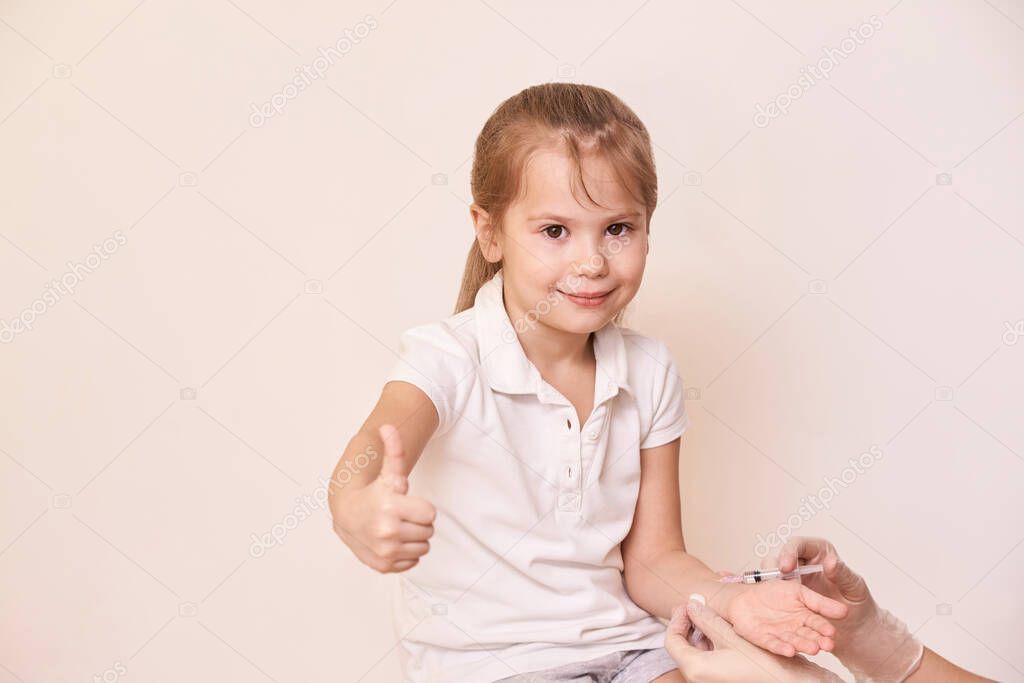 Doctor do injection to young girl. Kid immunization