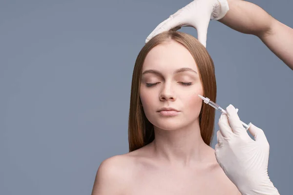 Young pretty woman studio portrait. Cosmetology injection concept — Stock Photo, Image