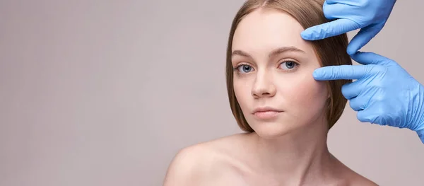 Young pretty woman studio portrait. Cosmetology gloves concept — Stock Photo, Image