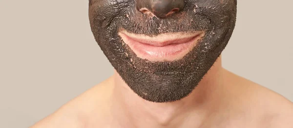 Black Clay Mask on the Guy Face — Stock Photo, Image