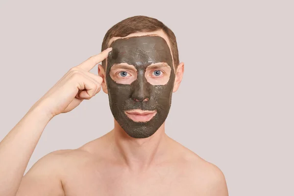 Black Clay Mask on the Guy Face — Stock Photo, Image