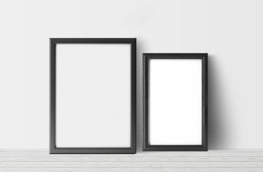 hafif ahşap zemin ve beyaz duvar arka plan boş karanlık fotoğraf çerçeveleri