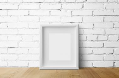 tuğla duvar arka plan üzerinde boş beyaz fotoğraf çerçevesi  