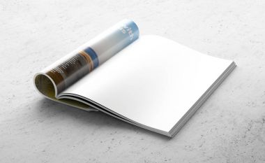 Gri beton zemin üzerine dergisinin temiz açılan sayfa