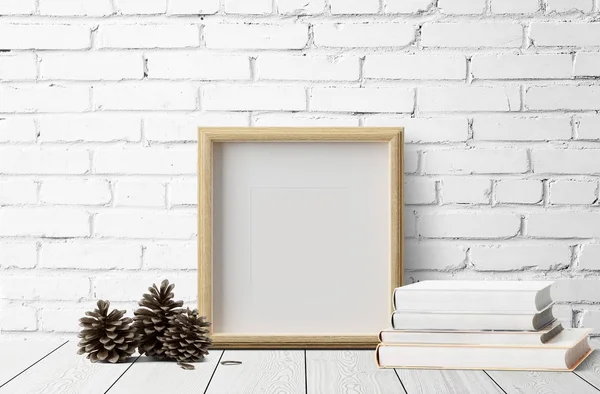 çam kozalakları ahşap zemin üzerinde ve kitaplar ile boş fotoğraf çerçevesi 
