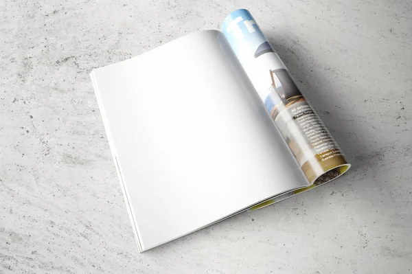 Gri beton zemin üzerine dergisinin temiz açılan sayfa