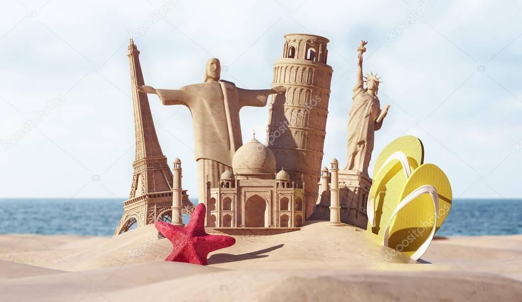 sand figures in form of popular tourist attractions with flip-flops and starfish on seashore, travel concept 