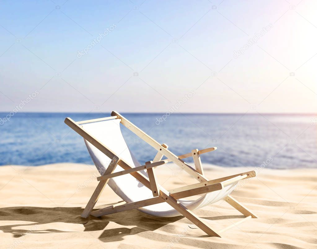 deck chair on sandy beach of seashore 