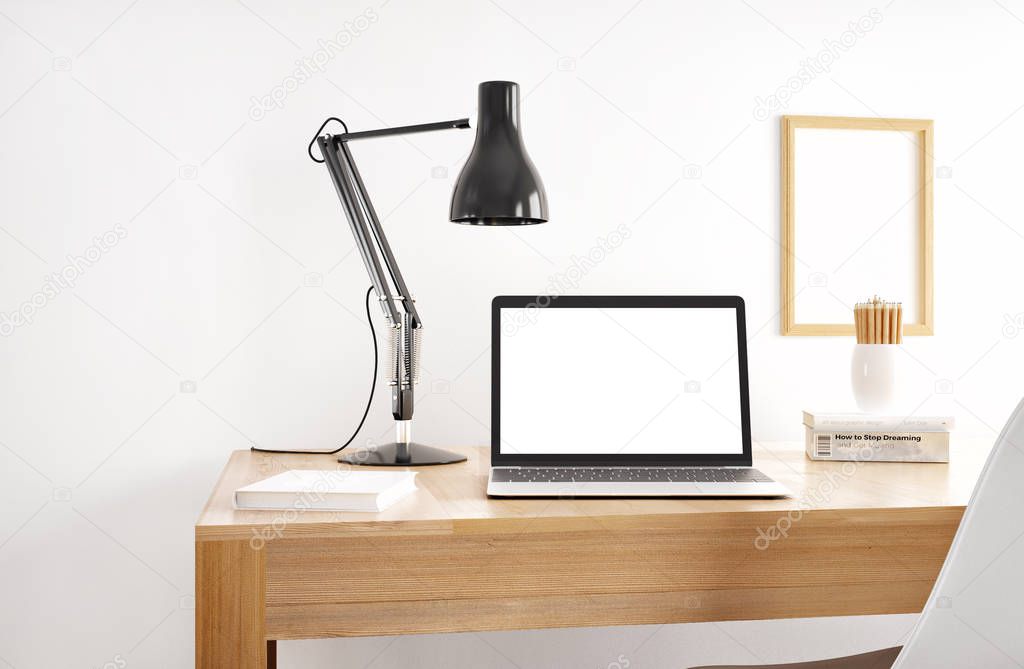 laptop with empty white screen on wooden table 