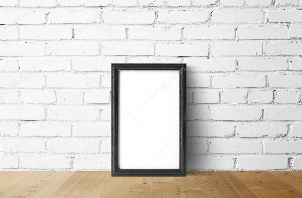 empty dark photo frame on brick wall background  