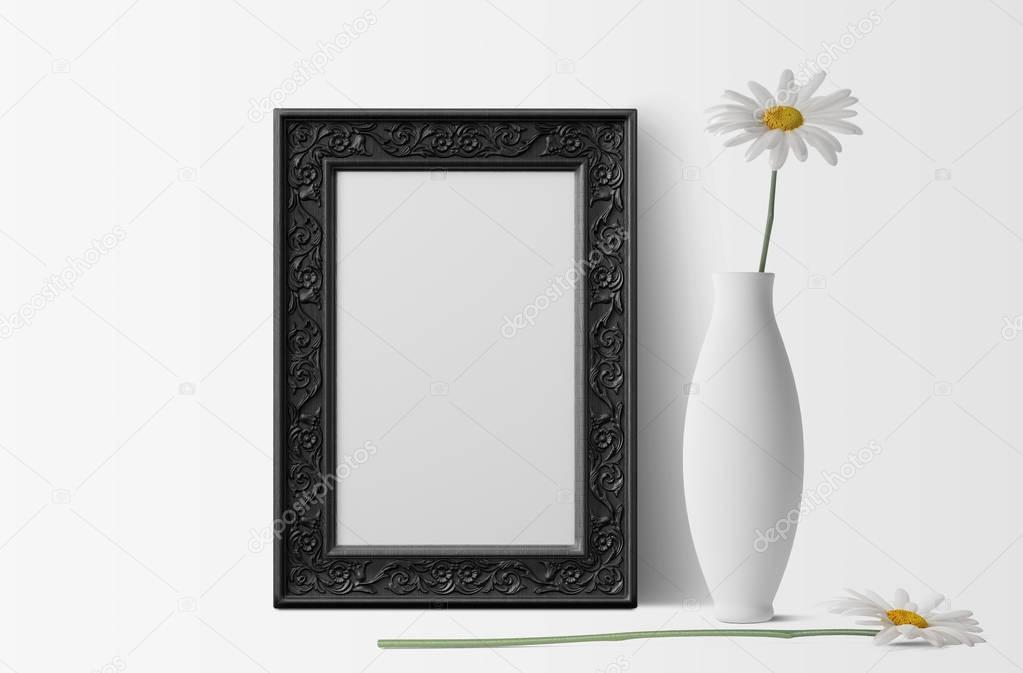 empty photo frame with white chamomiles and vase 