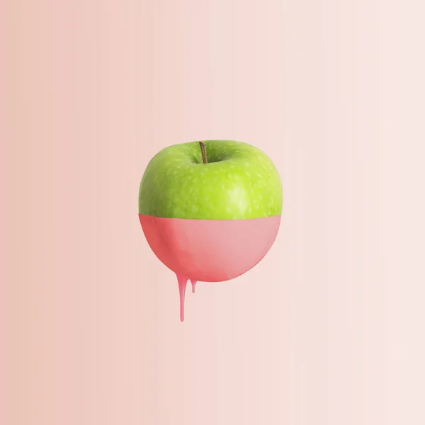 Half painted apple on orange background, fruit decoration concept