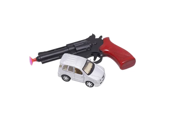 Leksakspistol och bil. — Stockfoto