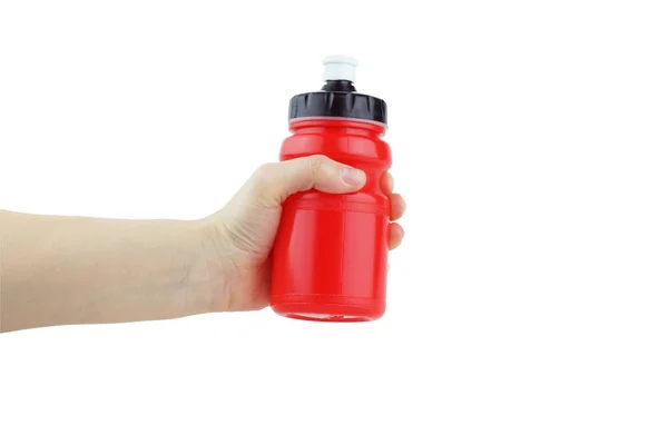 Sports red bottle for water in hand. — Stock Photo, Image