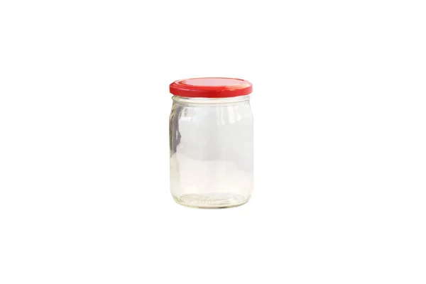 Empty glass jar with a red lid. — Stock Photo, Image