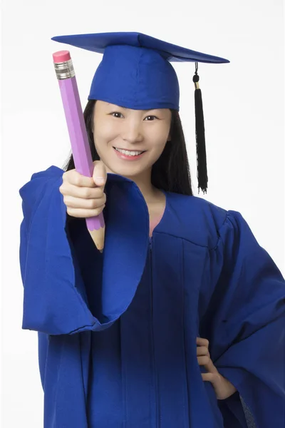 Asian woman wearing blue graduation holding  pencil isolated whi — Stock Photo, Image