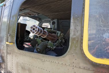 M134 Minigun inside  Huey helicopter at War Remnants Museum in H clipart