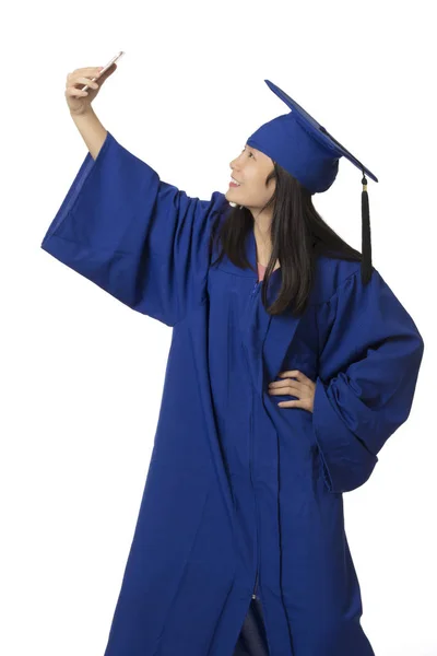 Asian woman using a smartphone to take a salfie of herself weari — Stock Photo, Image