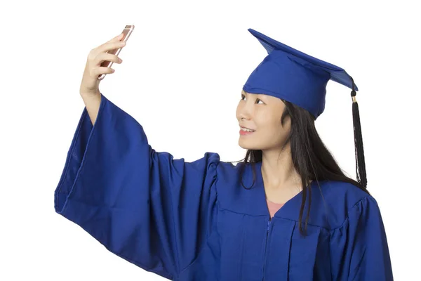 Asian woman using a smartphone to take a salfie of herself weari — Stock Photo, Image