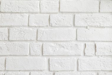 Beyaz dekoratif tuğlalardan oluşan arkaplan duvarı