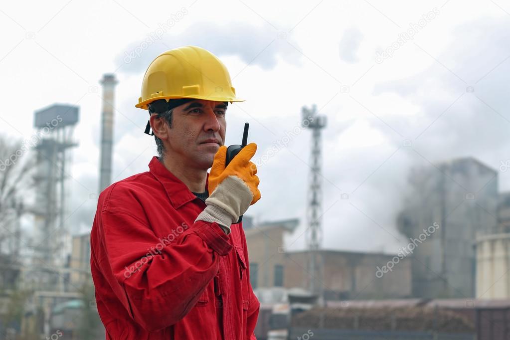 Factory Worker Using Radio Communication Device