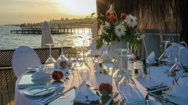 Beautiful Table Setting on Pier at Sunset — Stock Photo, Image