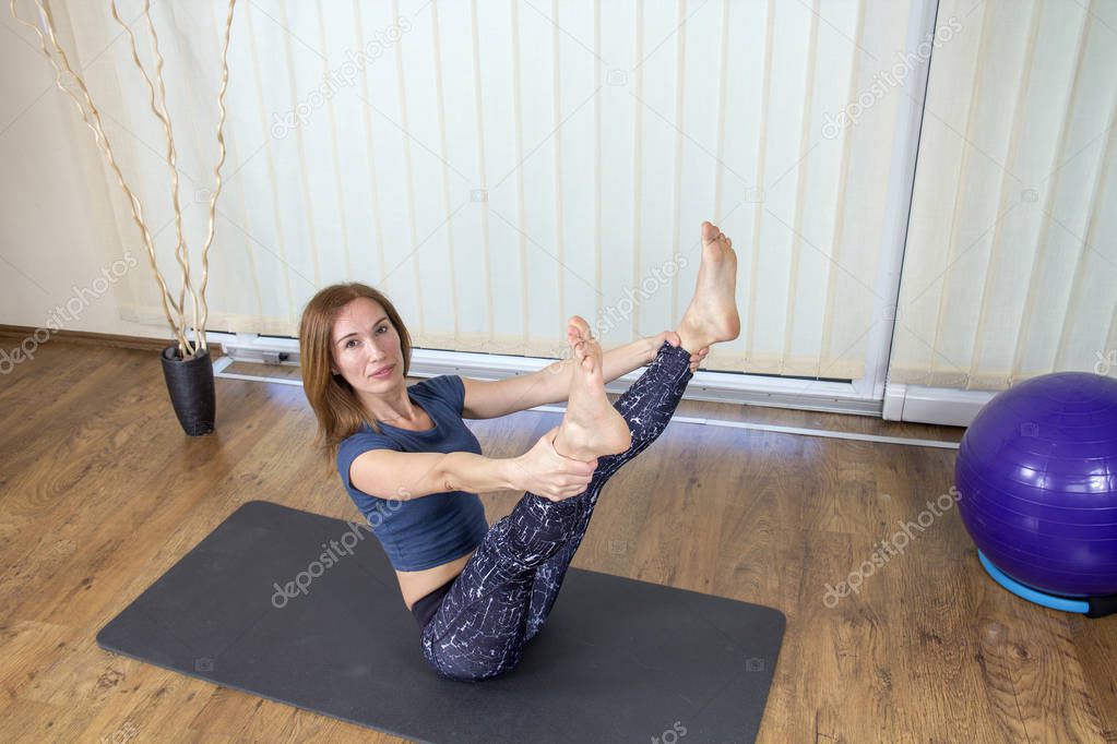Sportive Woman Exercising at Home