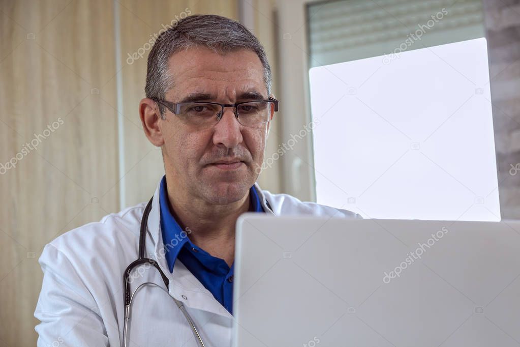 Medical Doctor Using Laptop Computer