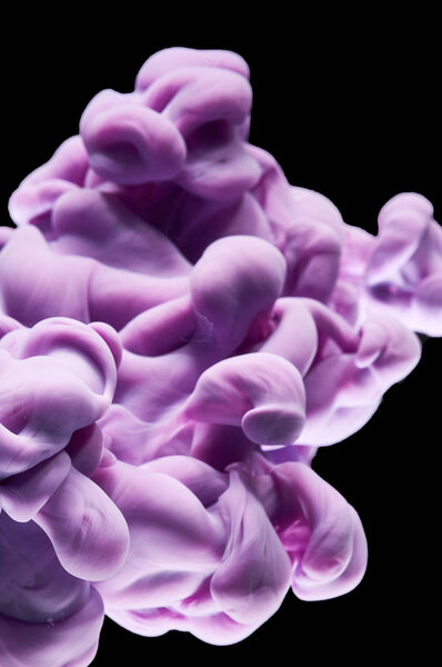 ink in the water. A splash of purple  paint. Abstract background