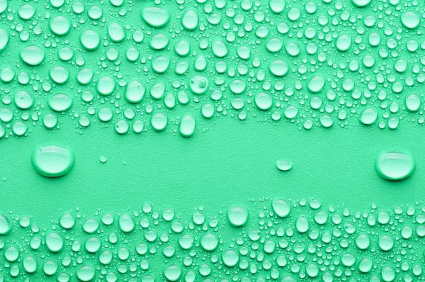 Water drops on a green background — Stock Photo, Image