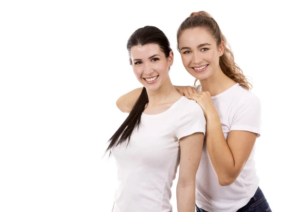 Two female friends on white background — Stock Photo, Image