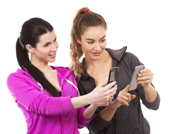 Two female friends on white background — Stock Photo, Image