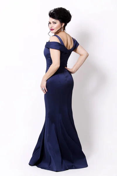 Brunette wearing navy long evening gown — Stock Photo, Image