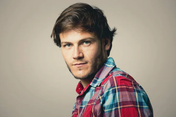 Caucasian man wearing checkered shirt and trendy hairstyle — Stock Photo, Image