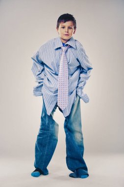 funny boy wearing Dad's clothes clipart