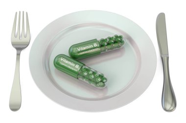 Diyet ve sağlıklı yemek kavramı. B12 vitamini kapsülleri ile plaka, 