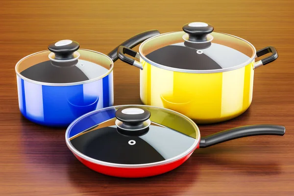Set of cooking colored kitchen utensils and cookware on the wood — Stock Photo, Image
