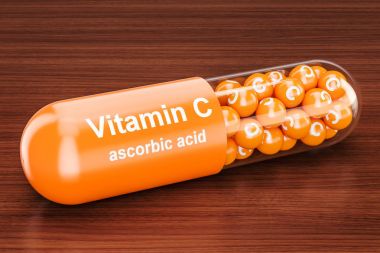 C vitamini kapsülü ahşap masa üzerinde. 3D render