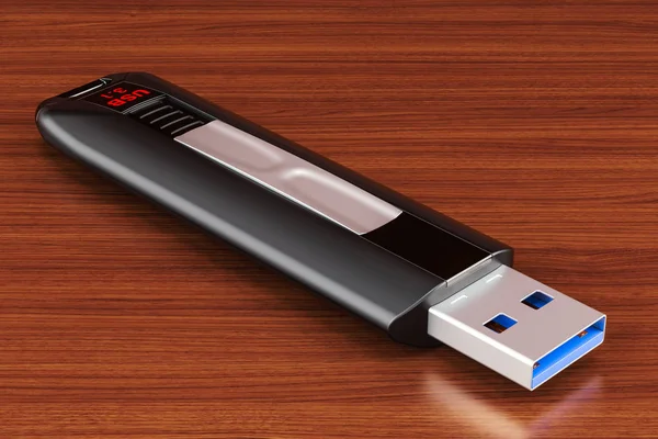USB flash sürücü ahşap masa üzerinde. 3D render — Stok fotoğraf