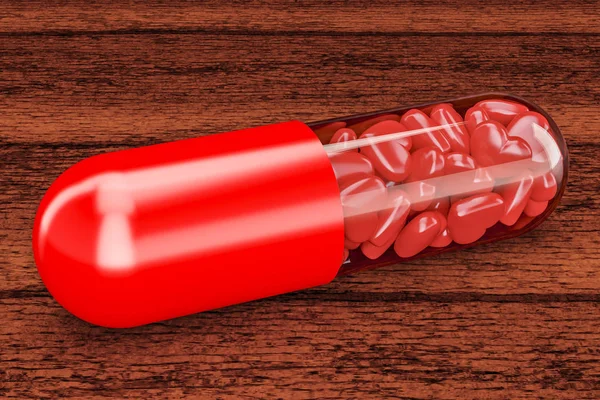 Pil kapsul dengan jantung merah di atas meja kayu. Rend 3D — Stok Foto