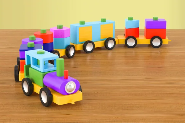 Tren de juguete de madera con bloques de colores en la mesa de madera. Rin 3D —  Fotos de Stock